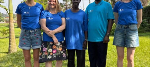 QST master trainers pose for photo with Mary Kabiito, Director of Kakunyu Junior Masaka (a special school) and mother of 4 children with special needs.